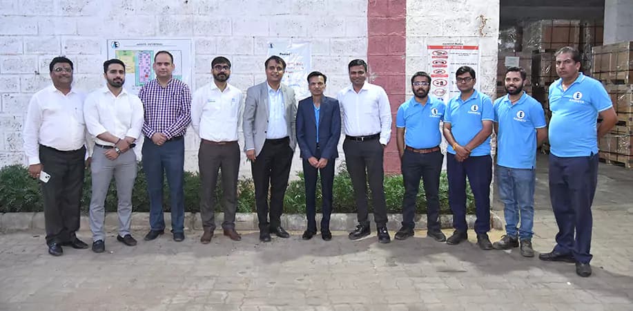 The Aashita Enterprises core team standing together outside the Jaipur plant